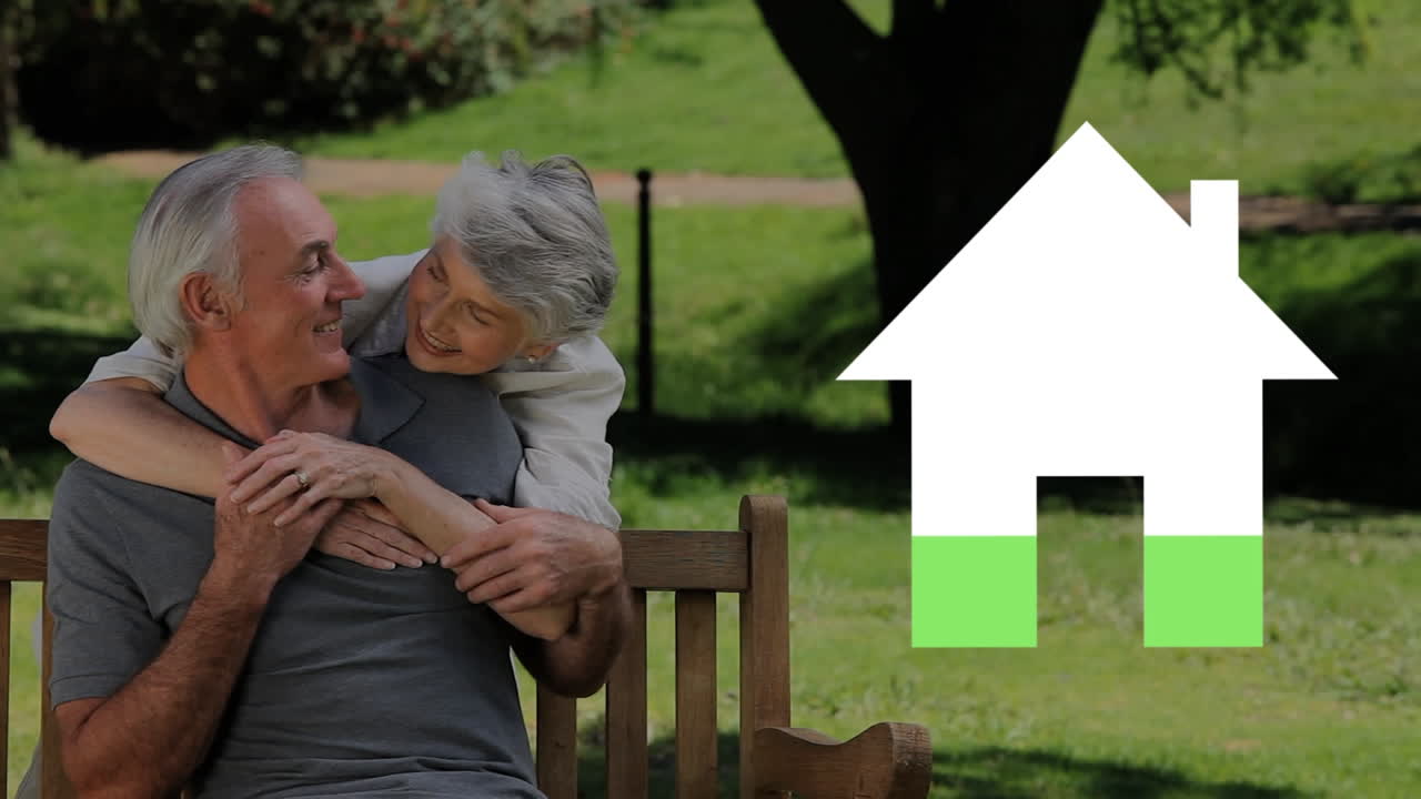 Senior couple outdoors and house iocn filling green