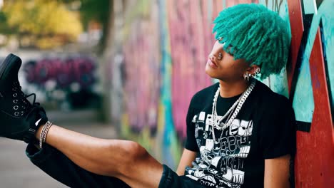 trendy teenager in urban setting with colorful hair