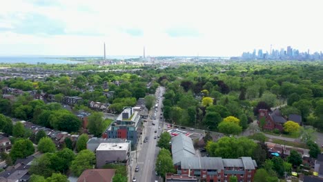 flying over a toronto baseball field in a suburban part of town on a sunny summer day