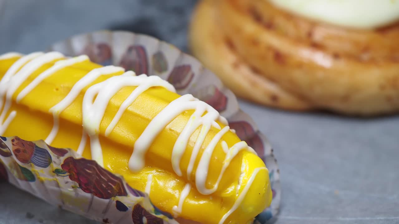 Close-up of a yellow glazed pastry