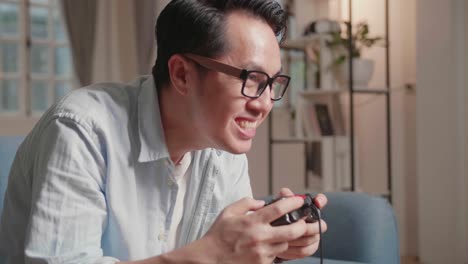 excited adult gamer using joystick play a game at home