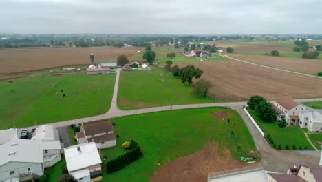 drone ariel view of amish farm lands and amish sunday meeting
