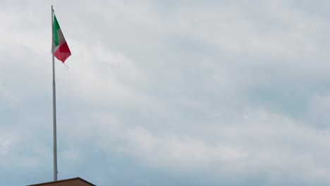 Italian-Flag-Waving-On-Top-Of-A-Building-In-Rome