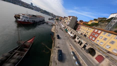 Fly-over-boats-and-riverside-FPV-drone-Dom-Luis-bridge-Porto-Portugal