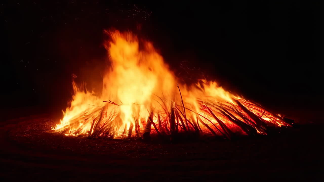 Large Bonfire Burning Brightly at Night