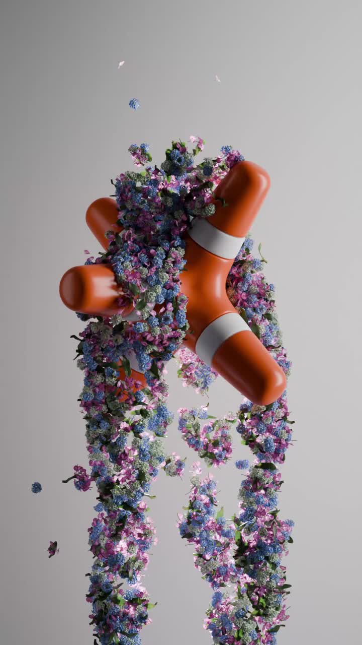 estructura geométrica con flores de naranja que caen