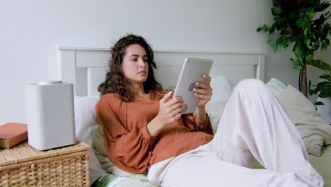 Caucasian-woman-lying-on-the-bed