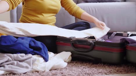 young woman preparation suitcase getting ready for road trip preparing luggage for vacation