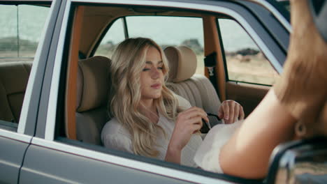 women in a vintage car