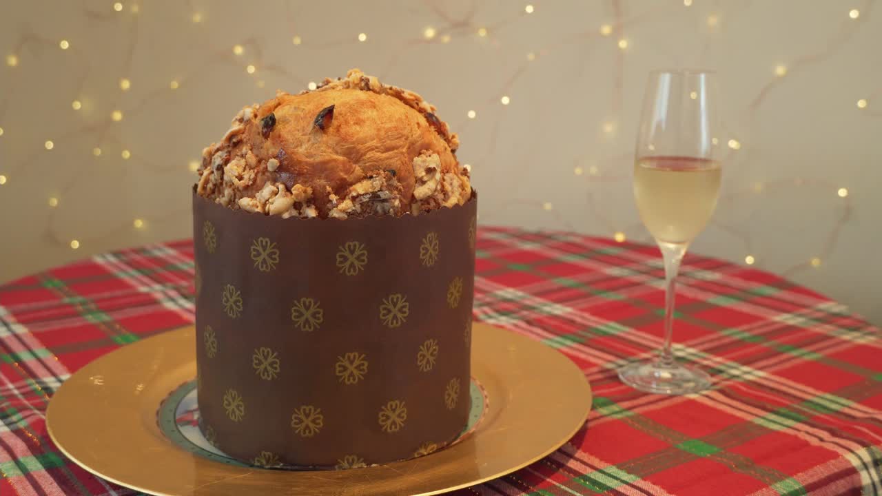 Traditional Christmas Italian Panettone and champagne, festive bread.