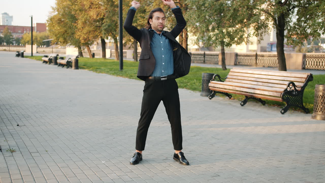 Man dancing in a city park