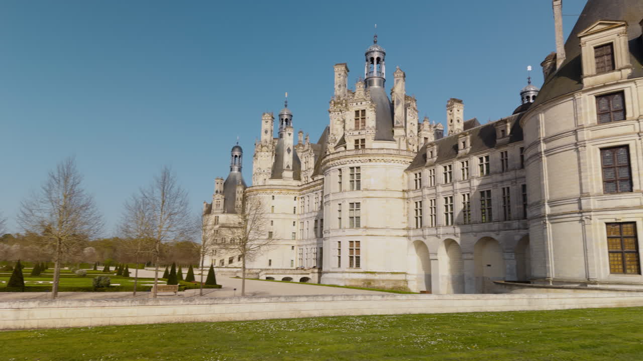 Majestic Renaissance castle in France with blue sky, wide view and calm atmosphere