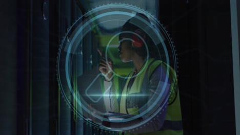 animation of cyber security text, magnifying glass, african american engineer checking data room