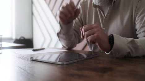 adult student using tablet in classroom