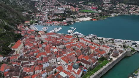 4K-drone-footage-captures-the-UNESCO-listed-Kotor-Old-Town-and-port-in-the-Bay-of-Kotor,-Montenegro