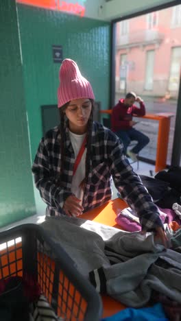 woman sorting donated clothes