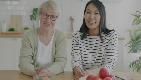 happy mother and daughter in the kitchen
