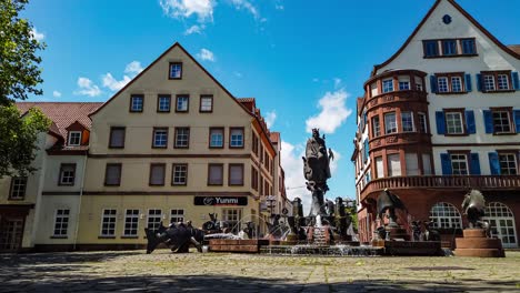 preserved german architecture in historical house facade and kaiserbrunnen fountain, motion time lapse