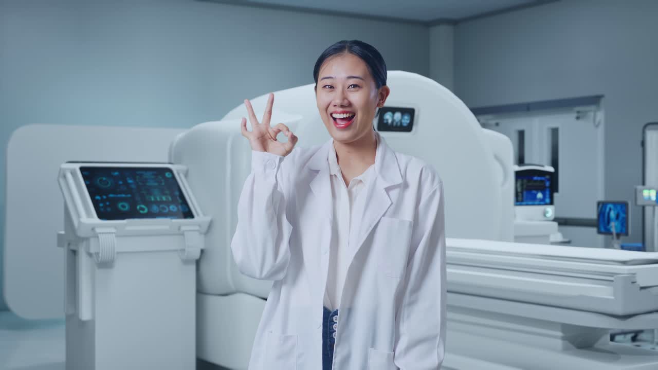 Asian Woman Doctor Showing Okay Gesture And Smiling With Mri Machine In The Hospital