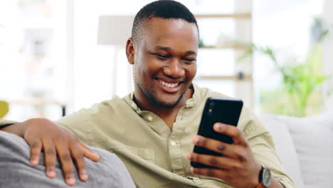 Black-man,-phone-and-smile-on-sofa-for-social