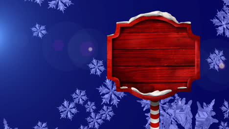 Animation-of-red-wood-sign-over-falling-snowflakes-on-blue-background,-copy-space