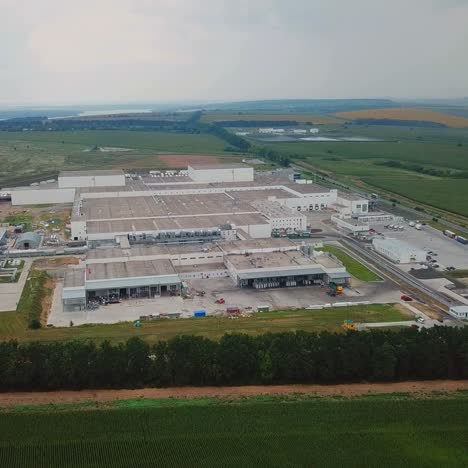 aerial view of warehouse with trucks. industrial background. logistics from above