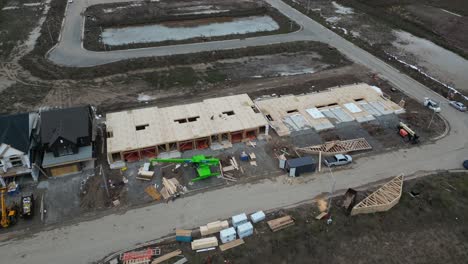 Aerial-of-suburb-wooden-townhouse-construction-from-builder-in-new-neighbourhood