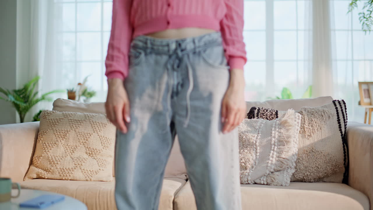 Relaxed girl sit couch resting from hard work day. Woman falling on home sofa