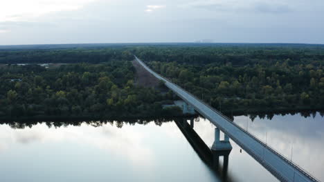 cold, somber panorama of a desolate bridge over pripyat river