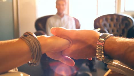 Close-up of couple holding hands