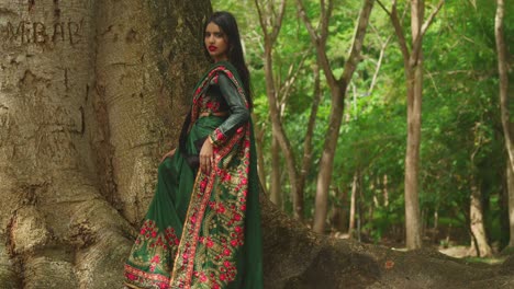 a young girl in traditional indian dress enjoys a day at a tropical park in the caribbean