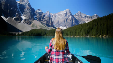 Woman-sitting-on-boat-in-river-at-countryside-4k