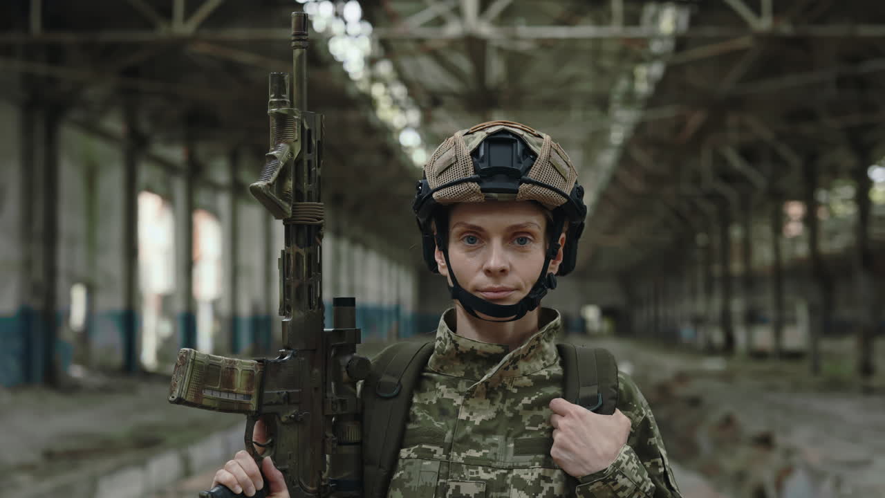 Female Soldier in Damaged Factory