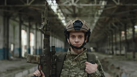 female soldier in damaged factory