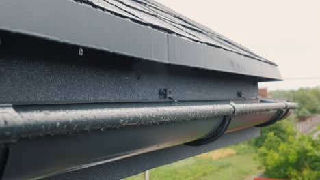 Rain-drain-into-gutters-on-the-roof-of-the-house-6