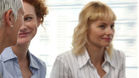 businesswomen sitting and talking after a seminar
