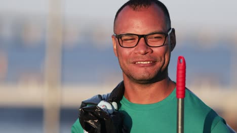 cheerful volunteer smiling at camera