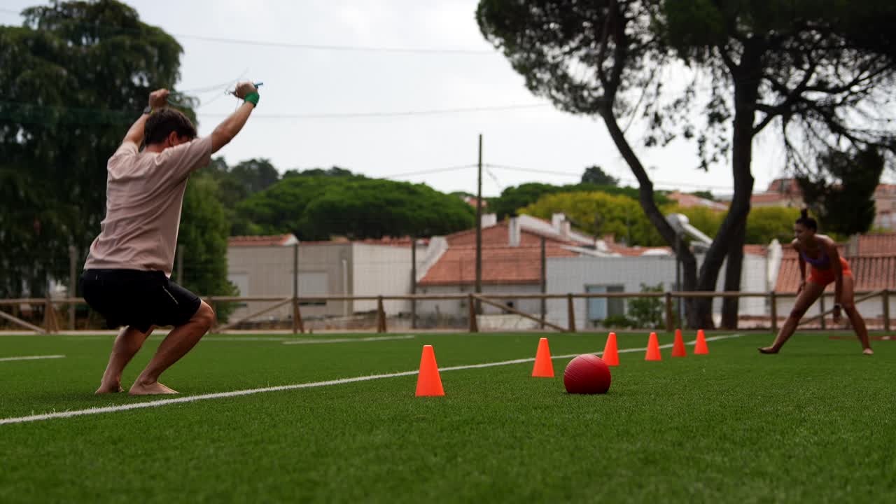 People doing agility drills on grass