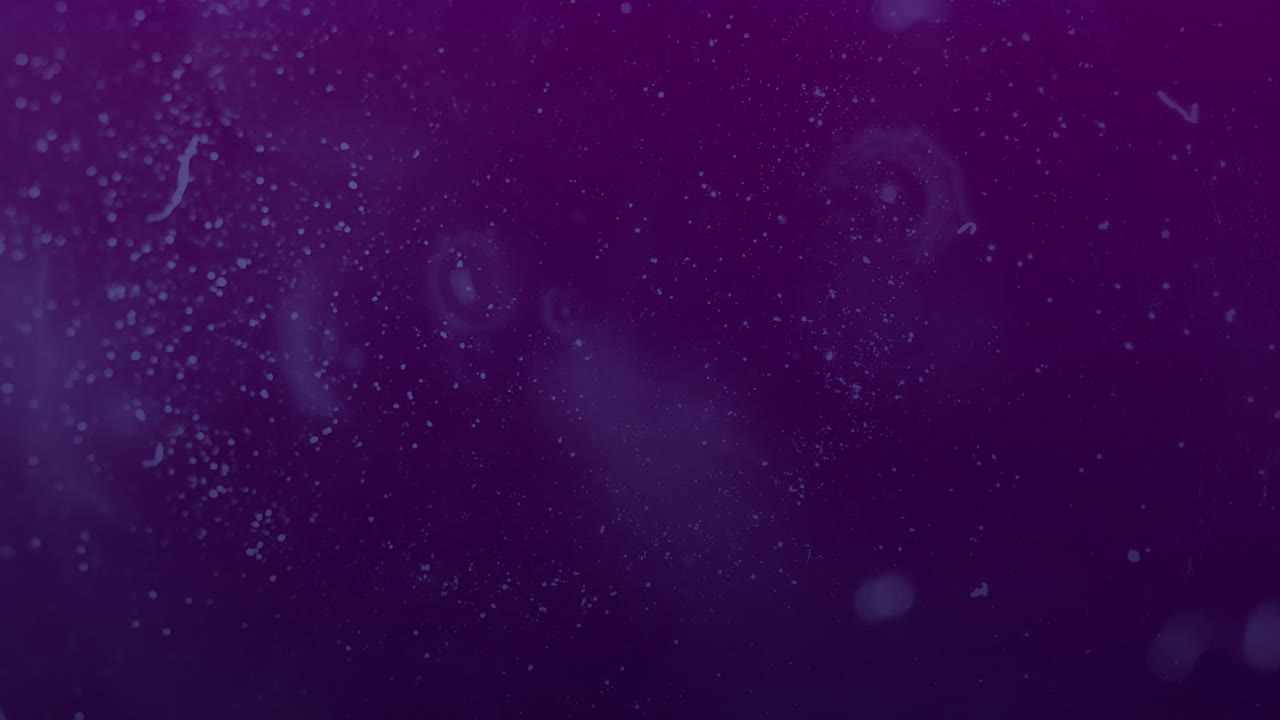 animación de manchas blancas en movimiento sobre fondo púrpura