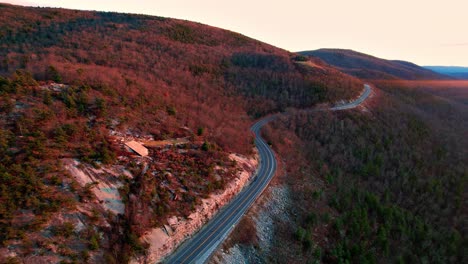 Aerial-drone-footage-of-a-beautiful-scenic-highway-in-the-Appalachian-mountains-during-fall-autumn-at-sunset-with-beautiful-light