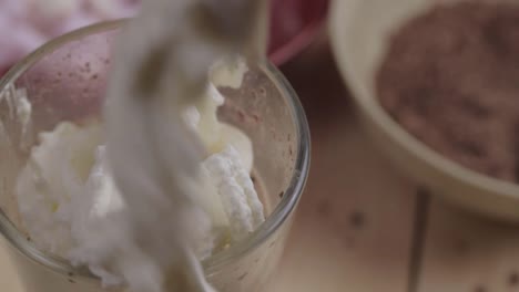 Fresh-whipped-cream-over-hot-chocolate-with-marshmallow-and-chocolate-ingredients