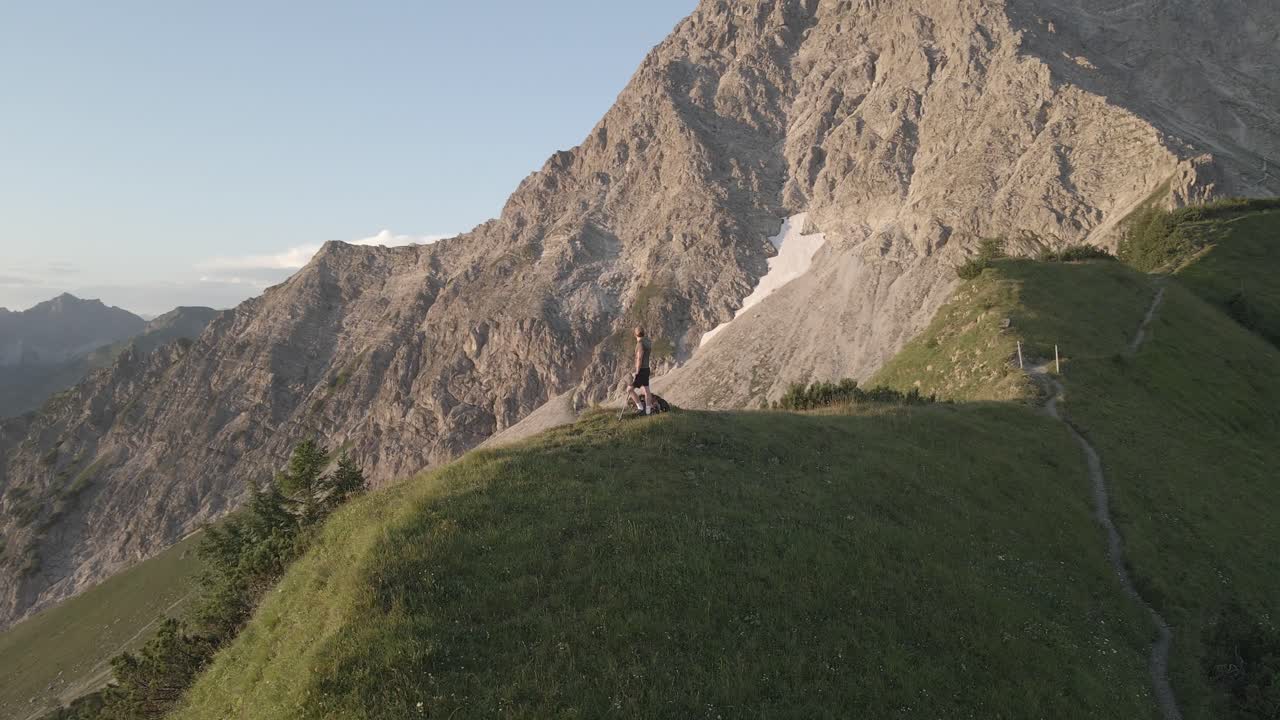 Enjoy breathtaking drone footage of a sunrise in Mannheimer Tal, Austria, featuring stunning alpine landscapes and a peaceful hiking experience in the early morning light.