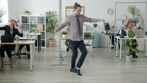 employees dancing in the office