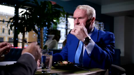 portrait of businessman at lunch in restaurant