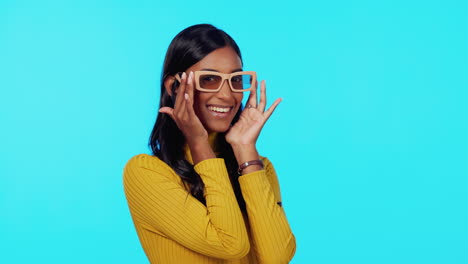 Face,-sunglasses-and-woman-wink-in-studio-isolated