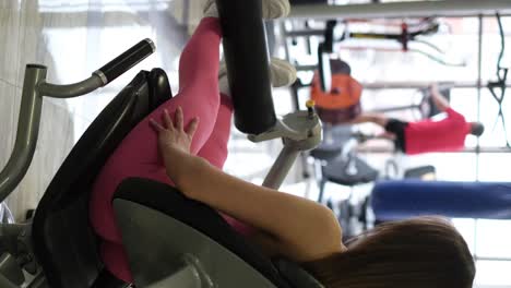 girl with a beautiful athletic body in the gym girl with a beautiful athletic body in the gym sports lifestyle concept professional athlete during muscle training in the gym