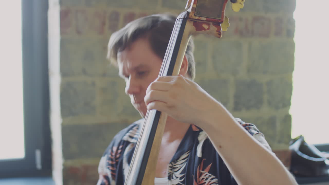 A musician playing an upright bass