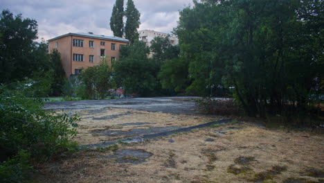 a brutalist, communist architecture building and the surrounding neighborhood environment from the communist era in eastern europe