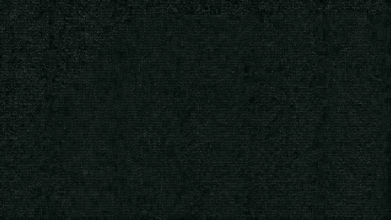 Tmavá černá textura látky s jemným tkaným vzorem.