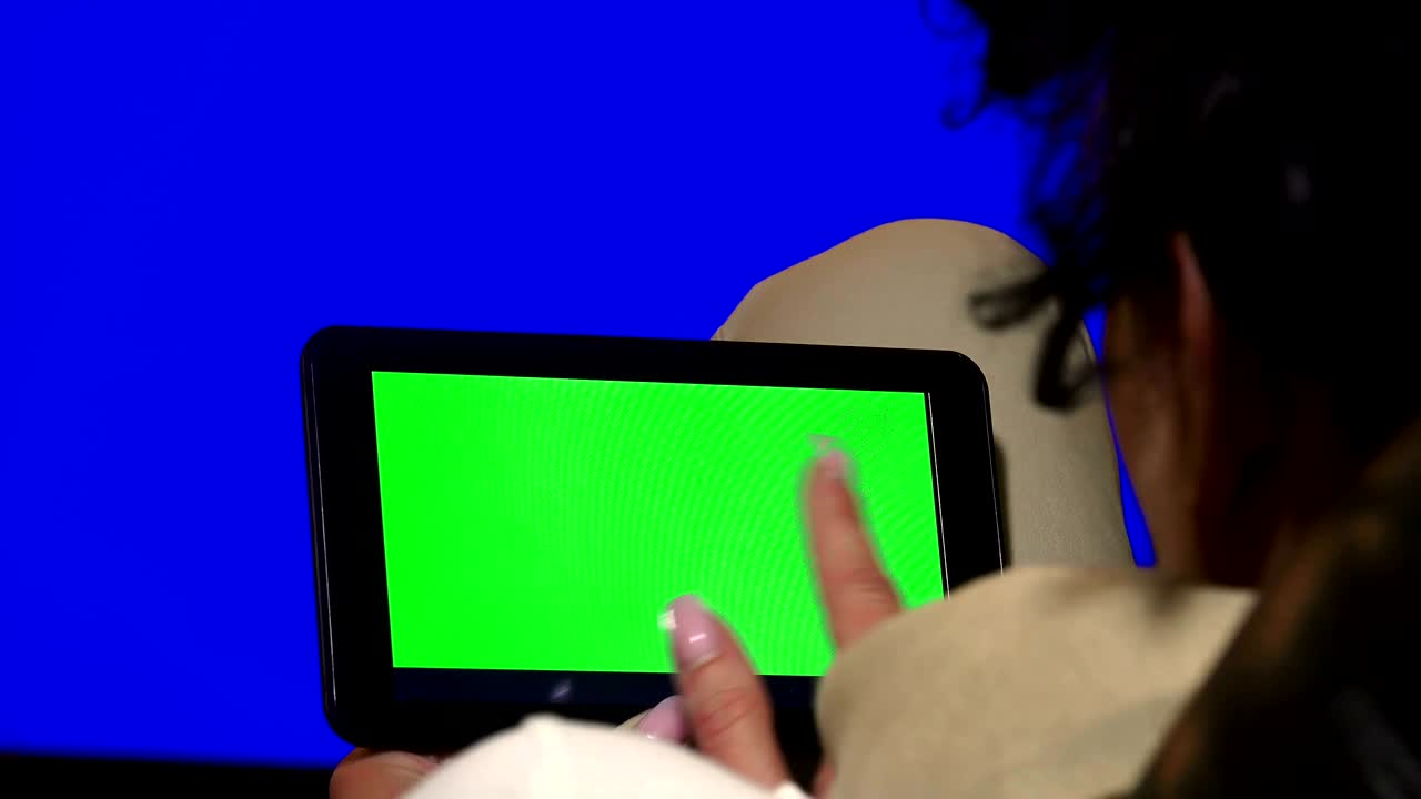Designer business woman using Digital Tablet with Green Screen in Landscape, UHD stock video, alpha luma matte included